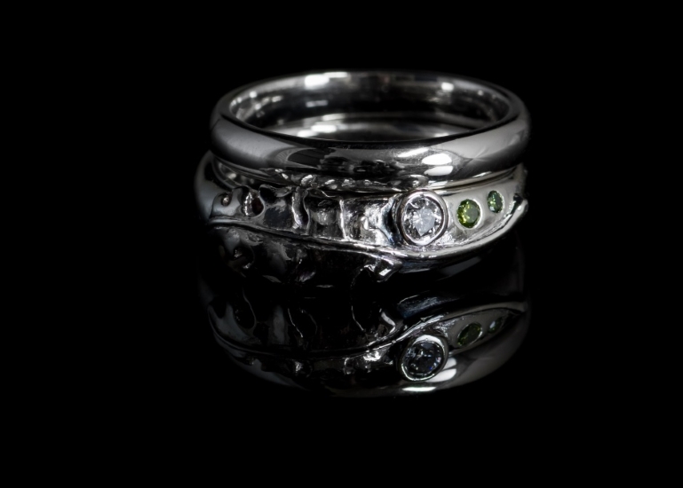 Palladium oak leaf engagement and wedding rings.